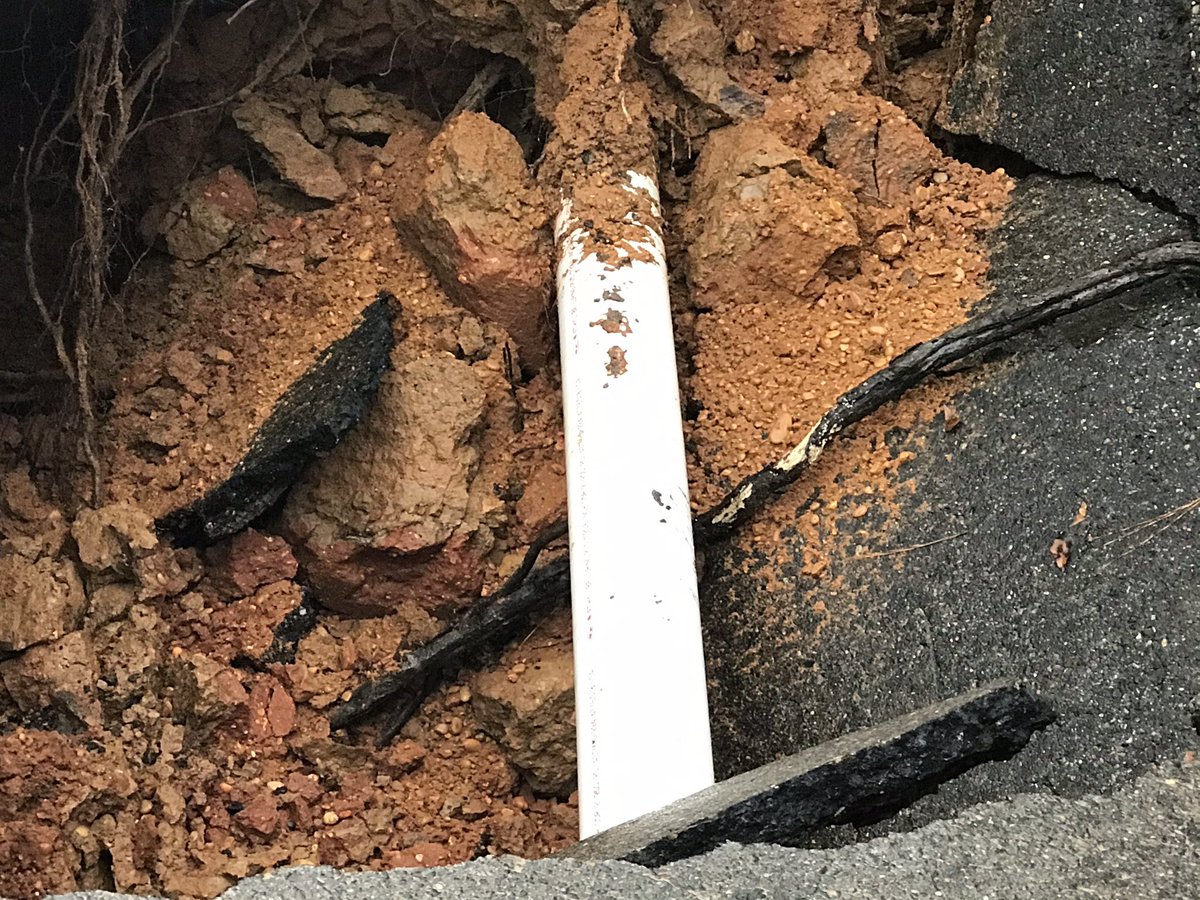 pipe busted due to heavy rain and flooding and that's what they believe caused the road to collapse