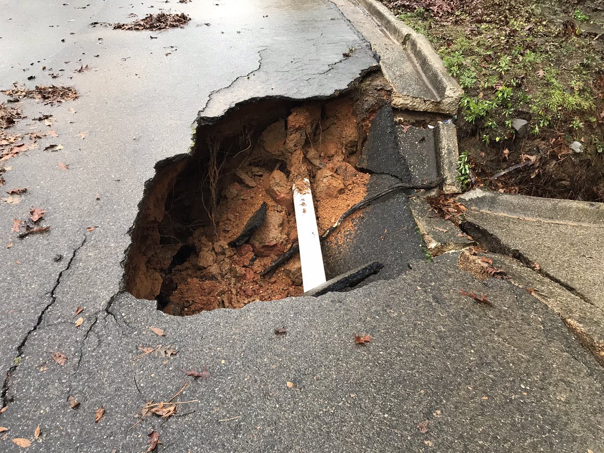 pipe busted due to heavy rain and flooding and that's what they believe caused the road to collapse