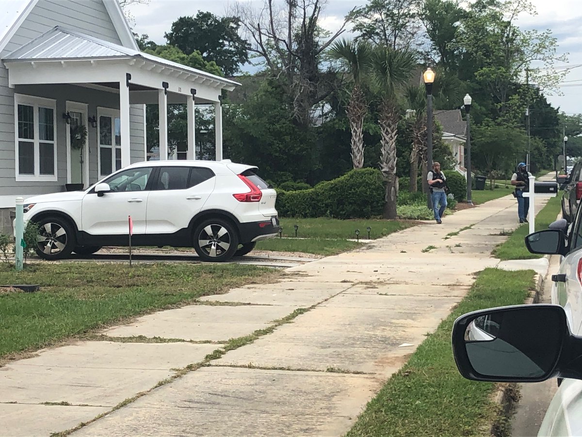 Plain clothes officers armed with rifles are searching this Thomasville neighborhood on the corner of Wright Street and Armster Lane for a man who shot at police earlier this morning   