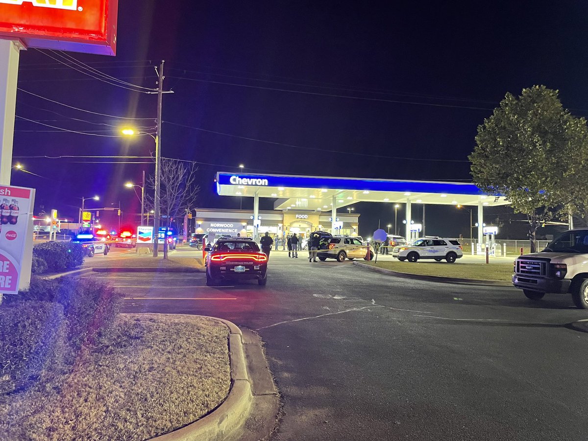 White car riddled with bullet holes at the front of this Chevron gas station on 12th Ave. N and 31st St. N.  3 people are shot as of now, per authorities