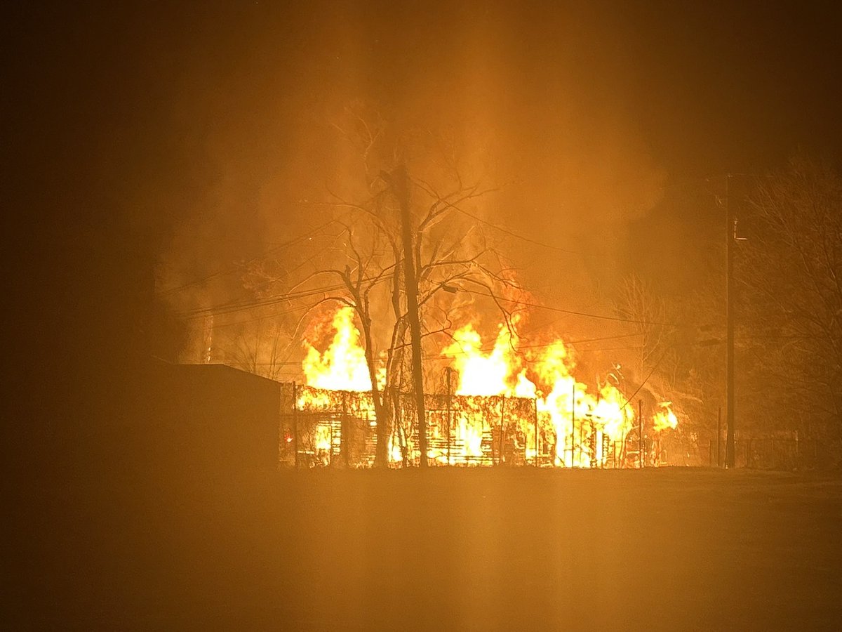 Heavy flames being shown at a structure on Rev Abraham Woods Jr blvd and 4th St N. This is across the street from A.H. Parker High School