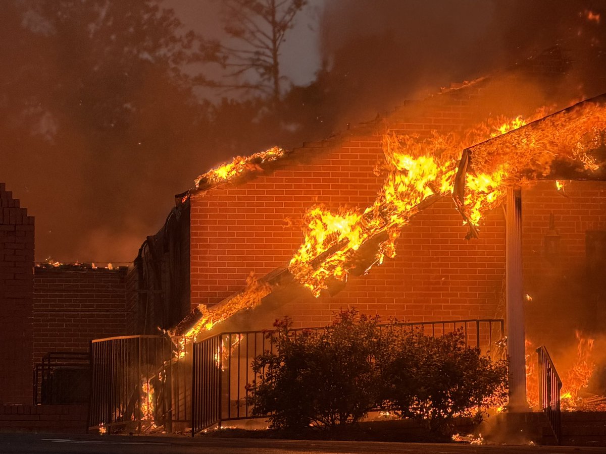 Fire operations continue as the church burns. The roof of the entire church has collapsed