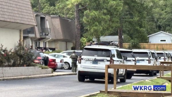 Man in Mobile accused of holding two people hostage, police say